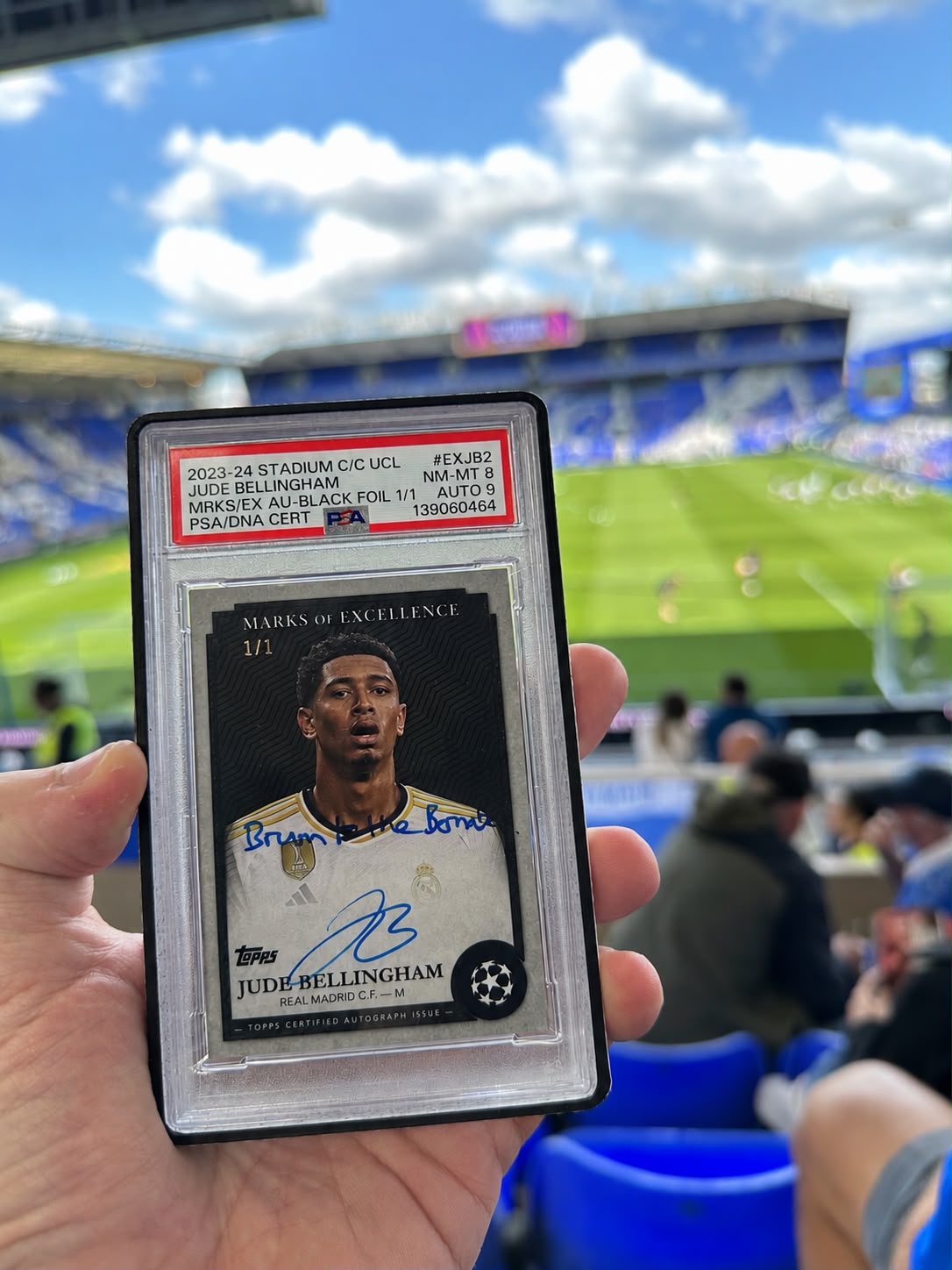 Liam holding his Jude Bellingham card at St Andrew’s